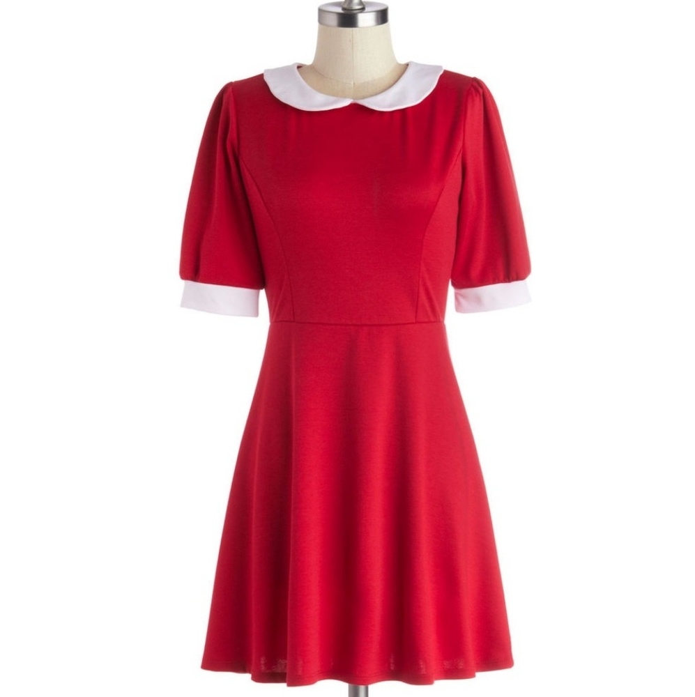 Red dress with white cuffs.